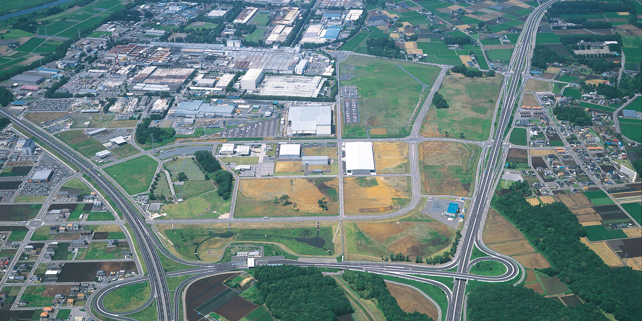Aerial view of an industrial park and a highway interchange