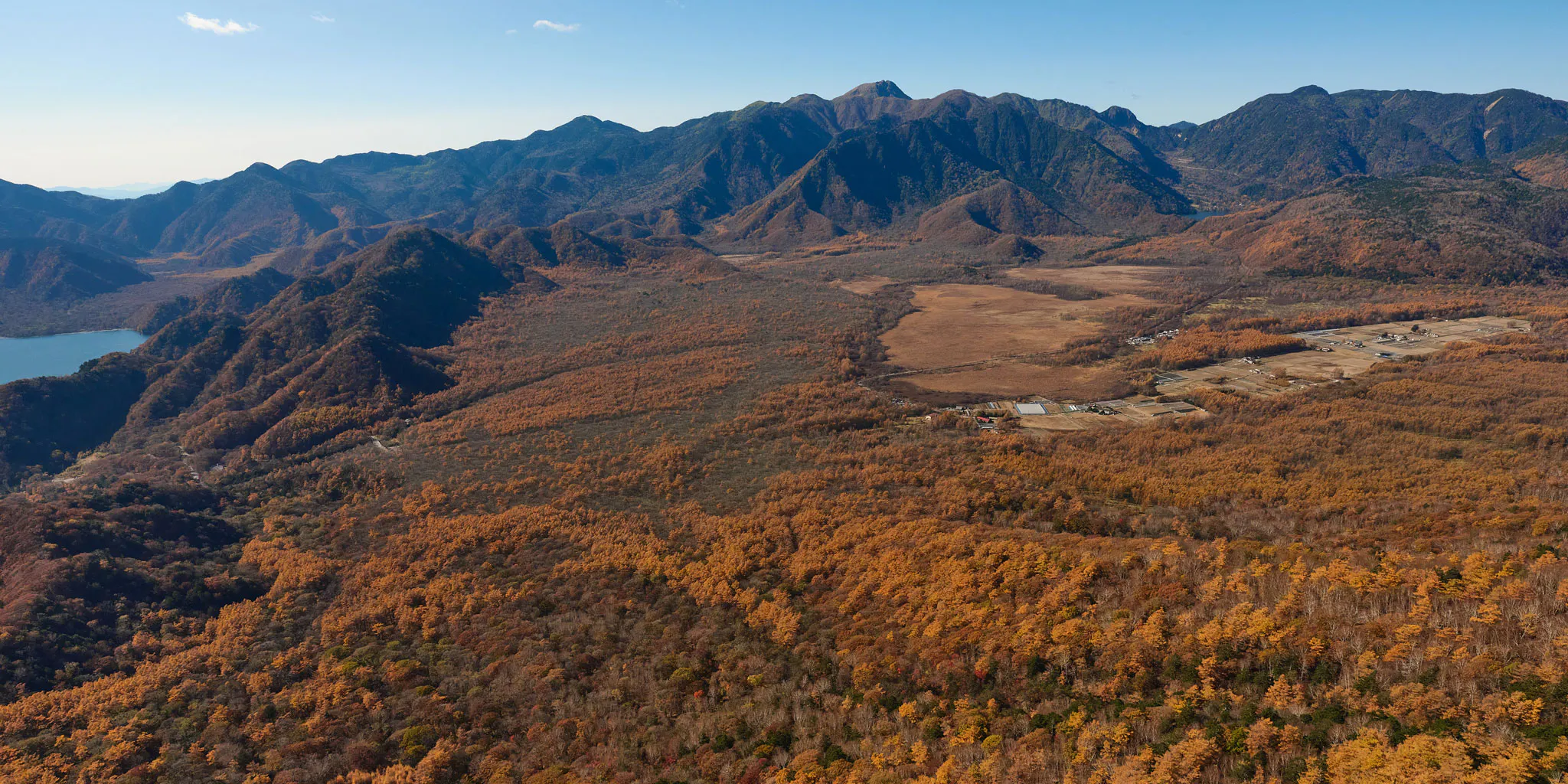 Aerial view overlooking the Senjogahara marshland plain surrounded by mountains