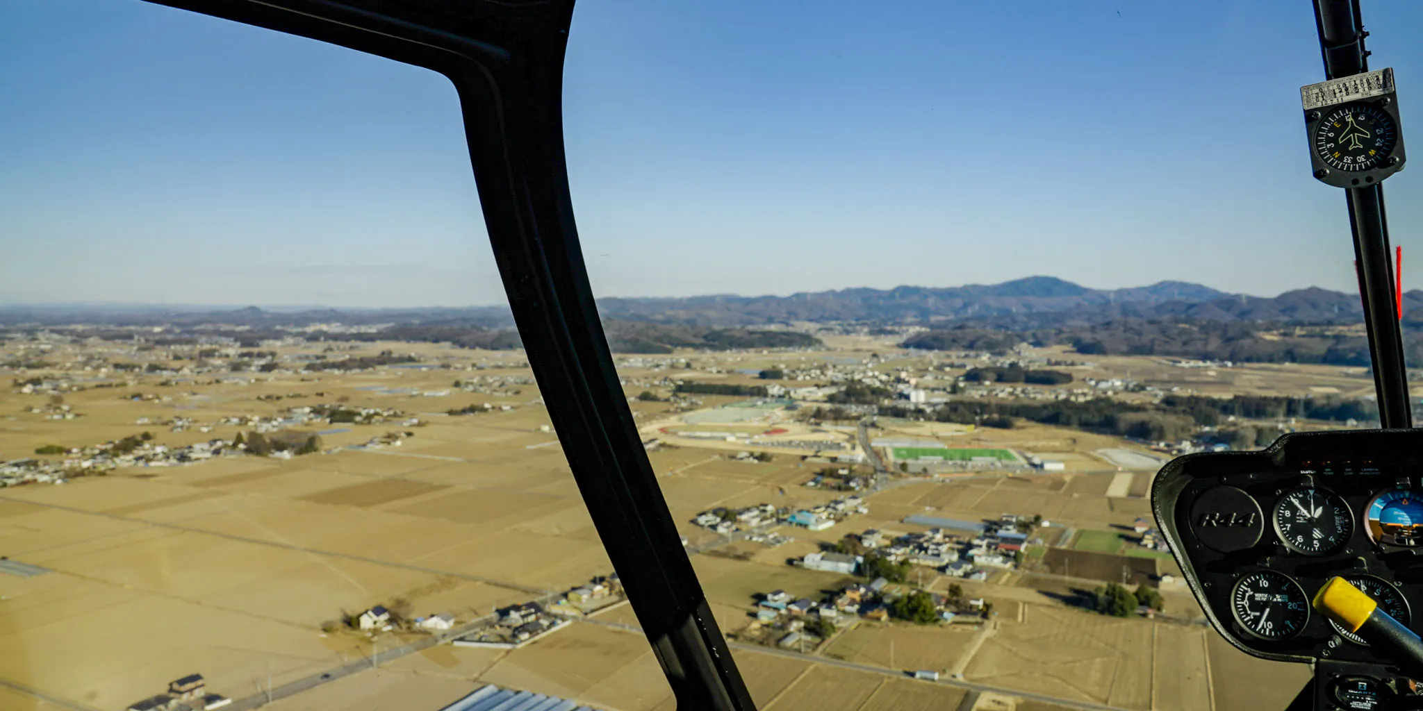 Rural landscape seen from the helicopter cockpit