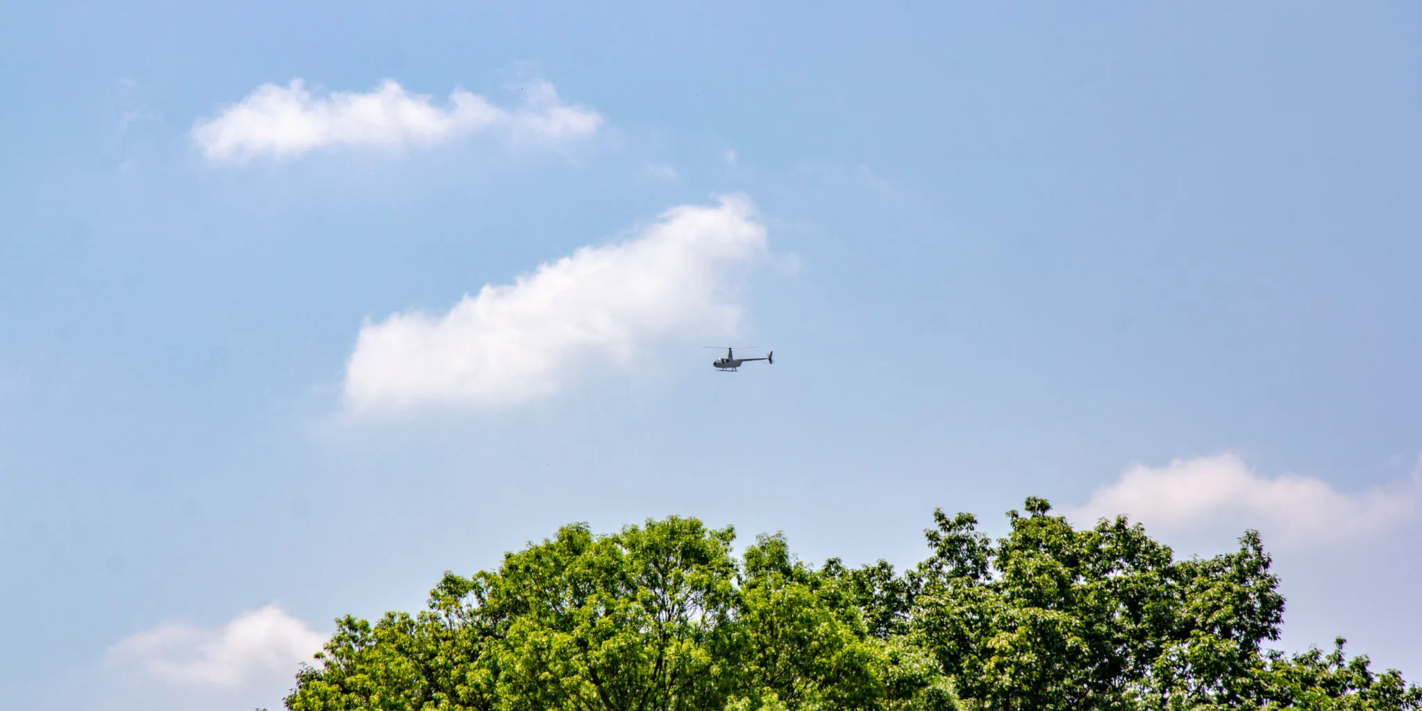 Helicopter flying in the blue sky