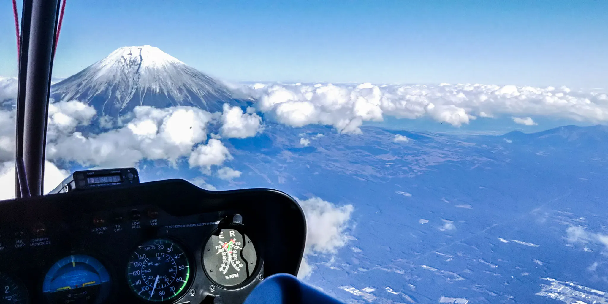 Sea of clouds and Mt. Fuji seen from the cockpit