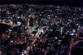 ヘリコプターで大阪上空から見る梅田駅周辺の夜景